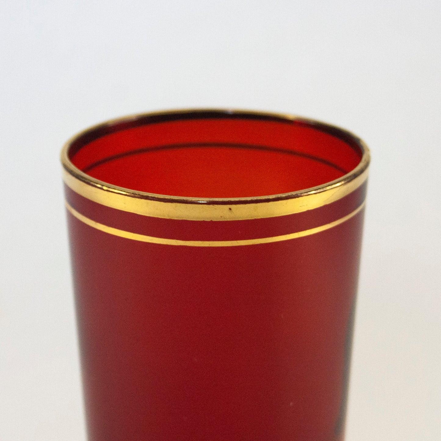 Modern Red Glass with Gold Rim